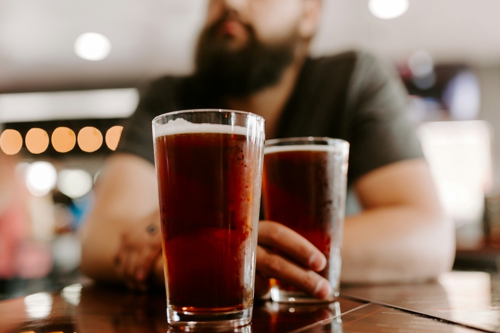 A couple enjoying beers in Kauai, Hawaii.